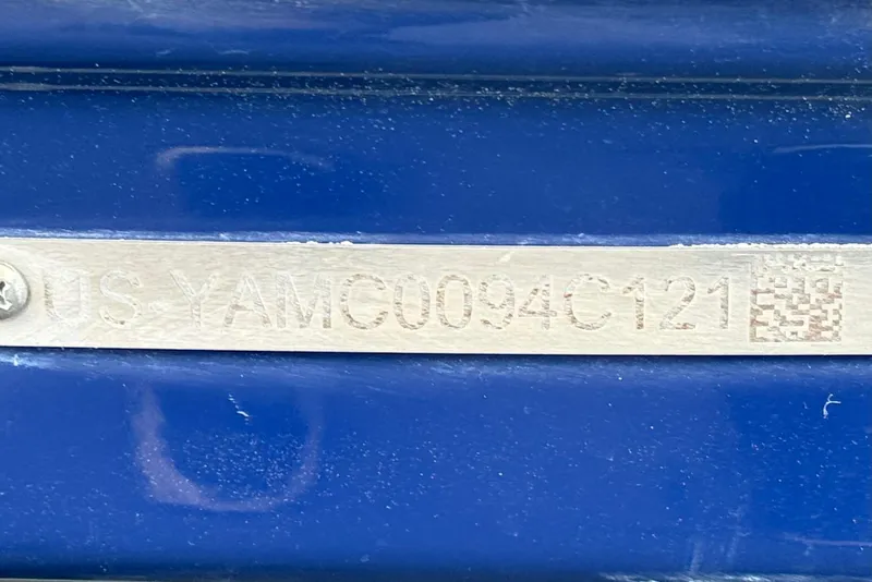 Slide: The Image of Hull identification number on a 2021 Yamaha Boats 195S, displayed on a blue surface. - 32