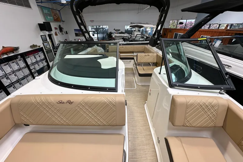 Slide: The Image of 2026 Sea Ray SDX 250 boat interior with beige seating and modern design. - 16