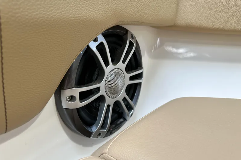 Slide: The Image of Speaker detail on 2026 Sea Ray SDX 250 boat with beige upholstery. - 18