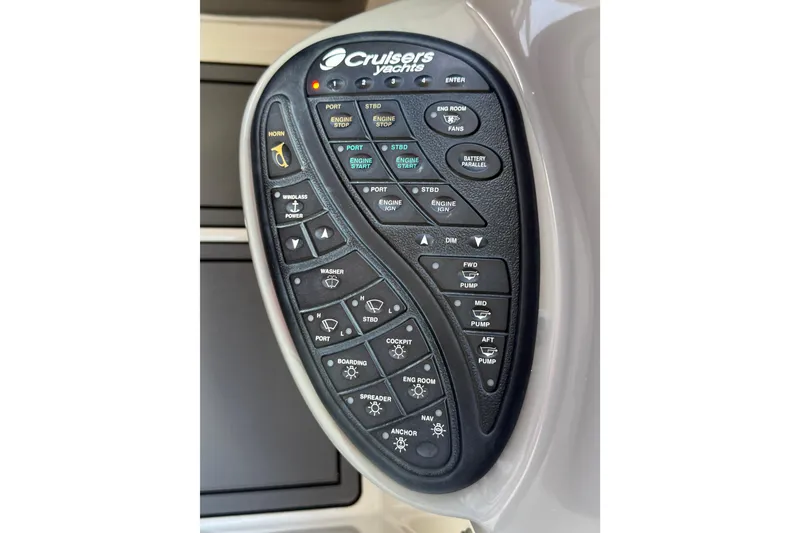 Slide: The Image of Control panel of 2005 Cruisers Yachts 420 Express with various function buttons. - 11