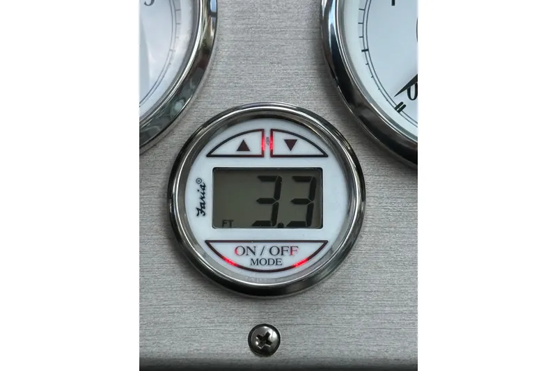 Slide: The Image of Digital depth gauge reading 3.3 feet on a 2005 Cruisers Yachts 420 Express. - 14