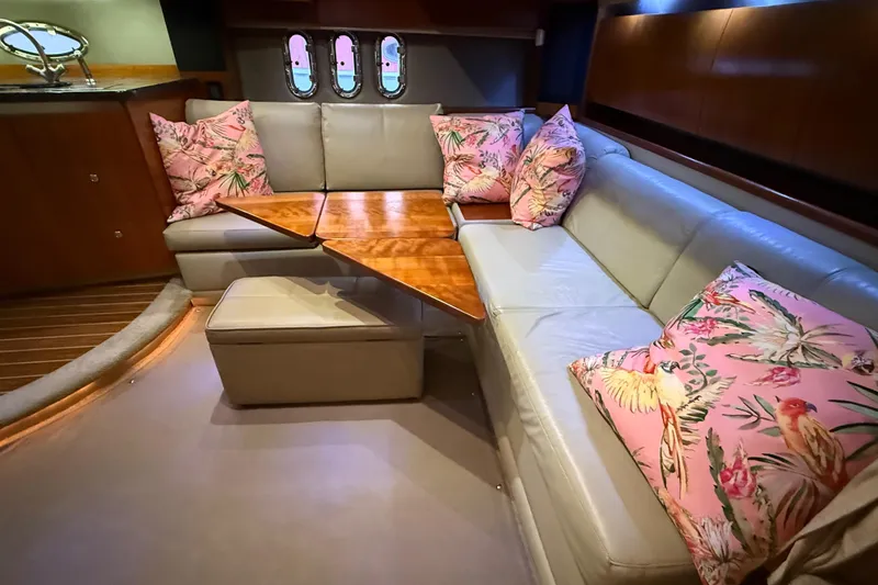 Slide: The Image of Luxurious 2005 Cruisers Yachts 420 Express interior with plush seating and floral cushions. - 19