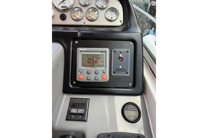 Slide: The Image of Control panel of a 2005 Cruisers Yachts 420 Express with navigation instruments. - 12