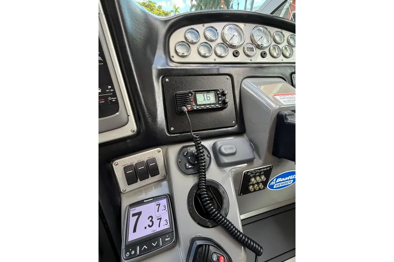 Slide: The Image of 2005 Cruisers Yachts 420 Express dashboard with gauges and communication equipment. - 15