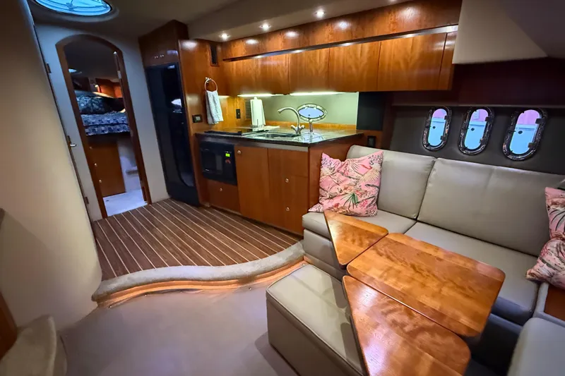Slide: The Image of Luxurious 2005 Cruisers Yachts 420 Express interior with modern kitchen and cozy seating area. - 18