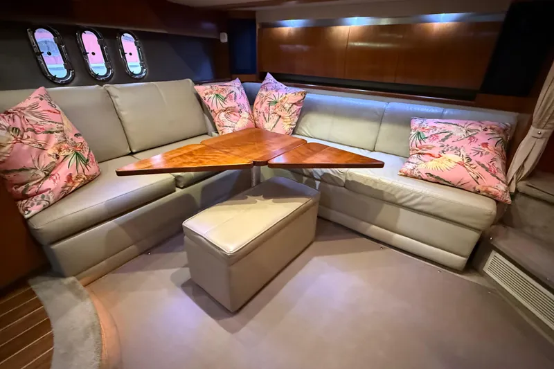 Slide: The Image of Luxurious interior of 2005 Cruisers Yachts 420 Express with plush seating and decorative pillows. - 20