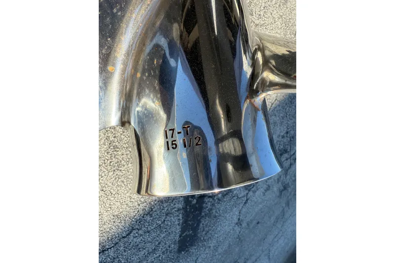 Slide: The Image of Close-up of a Pursuit C 250 Center Console 2008 boat propeller with engraved specifications. - 10