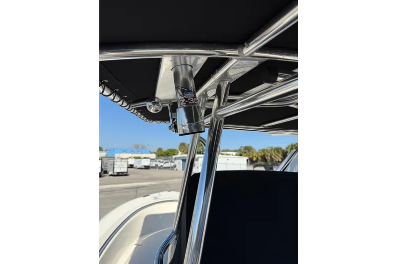 Slide: The Image of 2008 Pursuit C 250 Center Console boat with T-top and rod holder. - 12