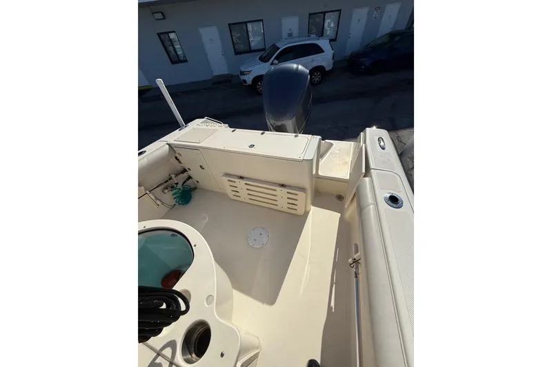 Slide: The Image of 2008 Pursuit C 250 Center Console boat interior with storage and seating. - 16