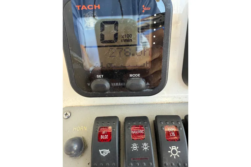 Slide: The Image of Close-up of 2008 Pursuit C 250 Center Console dashboard with Yamaha tachometer and control switches. - 20