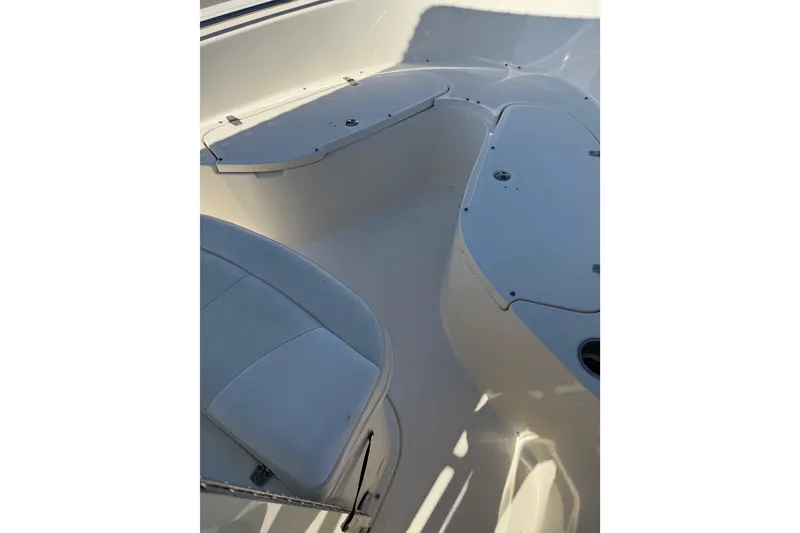 Slide: The Image of 2008 Pursuit C 250 Center Console boat interior with seating and storage compartments. - 22