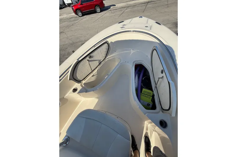 Slide: The Image of 2008 Pursuit C 250 Center Console boat interior with open storage compartment. - 23