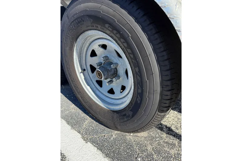 Slide: The Image of Close-up of a Goodyear tire on a 2008 Pursuit C 250 Center Console trailer. - 29