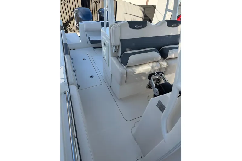 Slide: The Image of 2017 Robalo R302 Center Console boat interior with seating and storage compartments. - 11