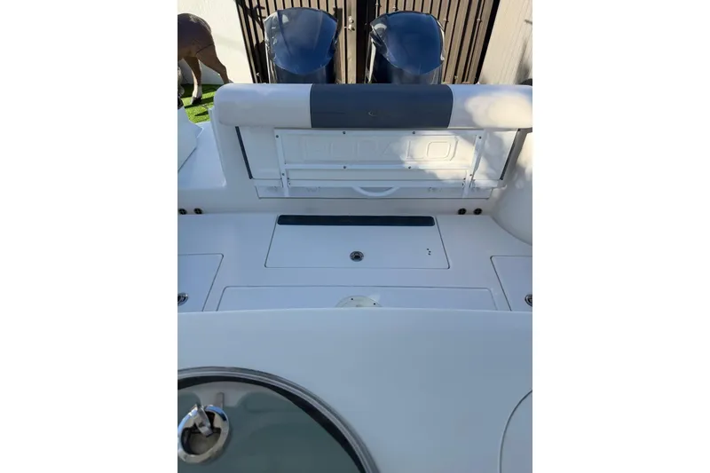 Slide: The Image of 2017 Robalo R302 Center Console boat interior with storage compartments. - 18