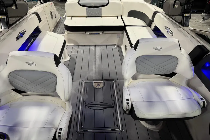 Slide: The Image of 2023 Chaparral 30 Surf boat interior with luxurious seating and modern design. - 11