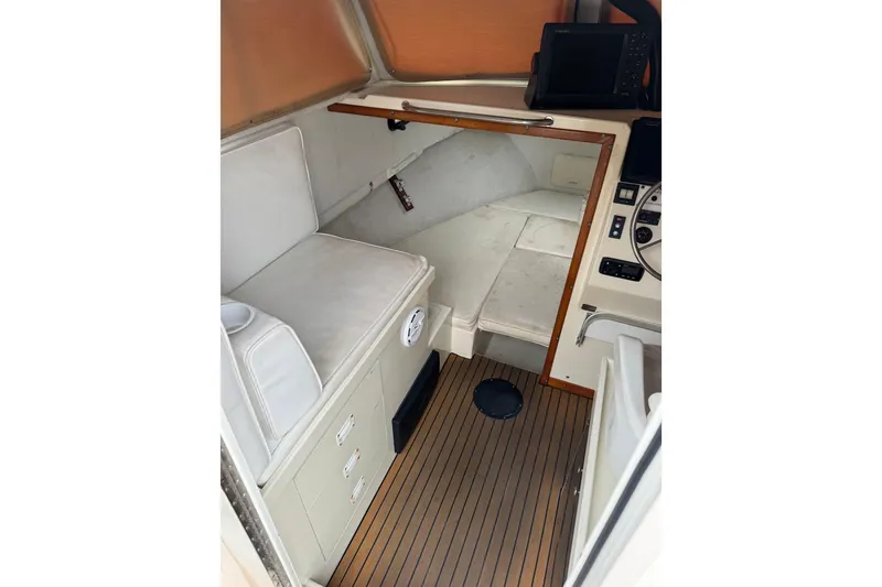 Slide: The Image of Interior of 2000 Parker 2520 XLD Sport Cabin with seating and navigation equipment. - 20
