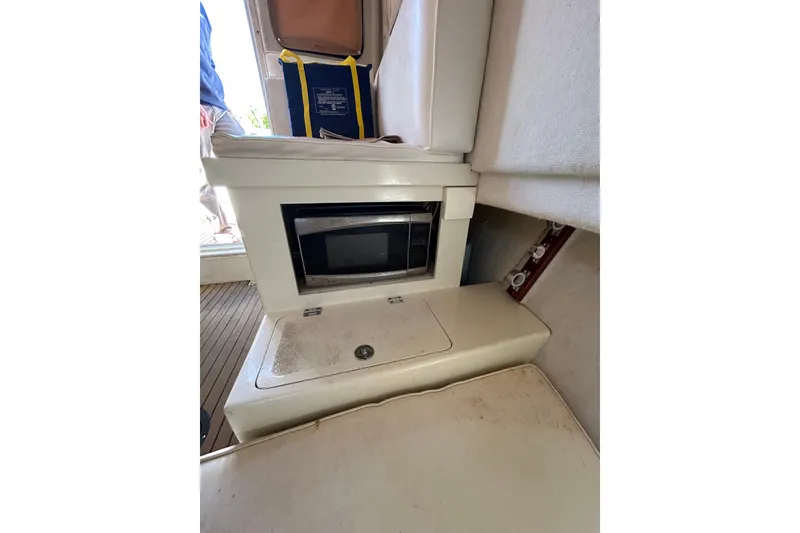 Slide: The Image of 2000 Parker 2520 XLD Sport Cabin interior with microwave and storage area. - 26