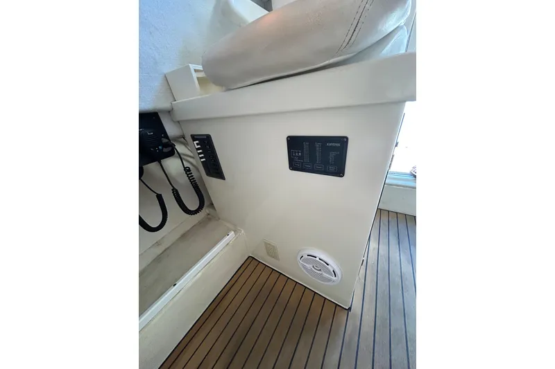 Slide: The Image of Interior of 2000 Parker 2520 XLD Sport Cabin with control panels and wood flooring. - 27