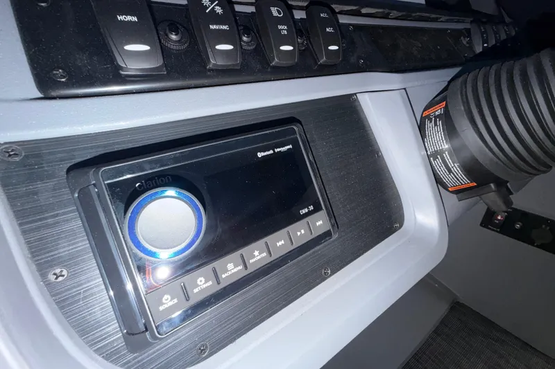 Slide: The Image of Control panel of 2026 Godfrey Sweetwater 2286 SBC with Clarion audio system. - 9