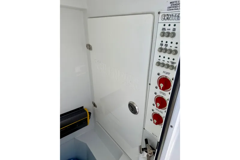 Slide: The Image of 2024 Contender 25 Tournament boat control panel with switches and dials. - 14
