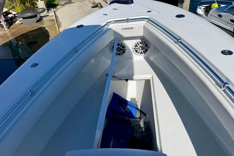 Slide: The Image of 2024 Contender 25 Tournament boat interior with storage compartment and speakers. - 7