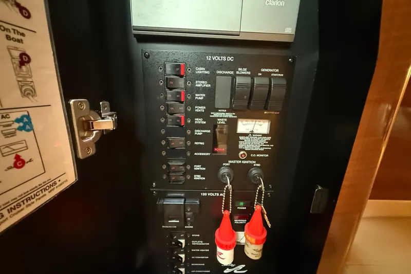 Slide: The Image of Electrical control panel of a 2003 Sea Ray 320 Sundancer boat. - 25