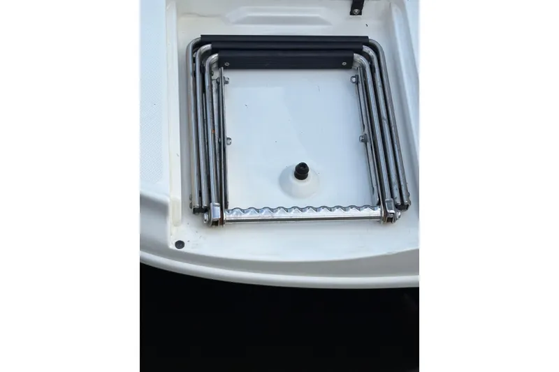 Slide: The Image of Folded swim ladder on a 2003 Sea Ray 320 Sundancer boat. - 40