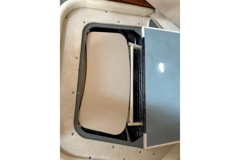 Slide: The Image of 2003 Sea Ray 320 Sundancer interior compartment with open hatch. - 54