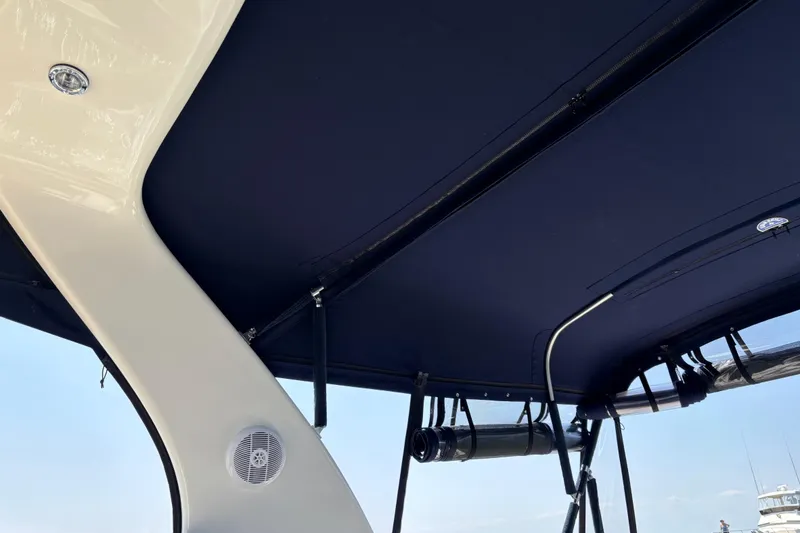 Slide: The Image of 2003 Sea Ray 320 Sundancer boat canopy and speaker detail. - 60