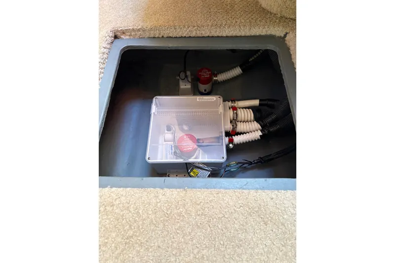 Slide: The Image of Electrical compartment of a 2003 Sea Ray 320 Sundancer boat, featuring wiring and switches. - 65