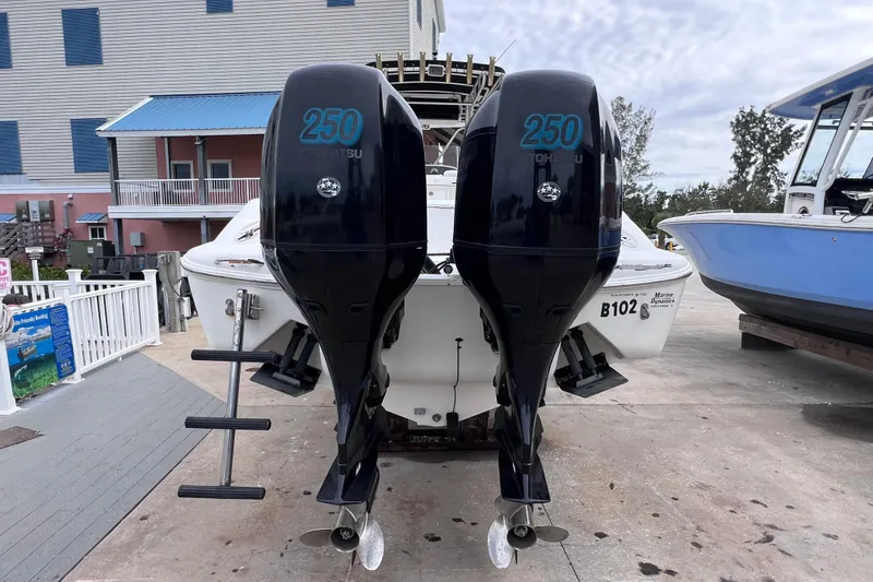 Slide: The Image of 2003 Wellcraft 29 CCF boat with dual 250 Tohatsu outboard engines on display. - 12