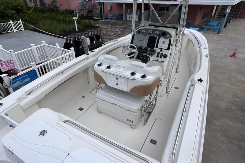 Slide: The Image of 2003 Wellcraft 29 CCF boat interior with helm, seating, and navigation equipment. - 16