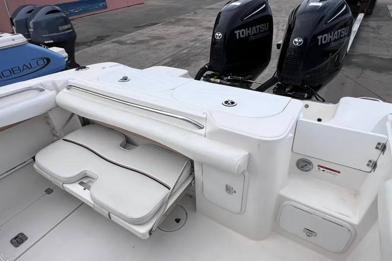 Slide: The Image of 2003 Wellcraft 29 CCF boat with Tohatsu engines and foldable seating. - 22