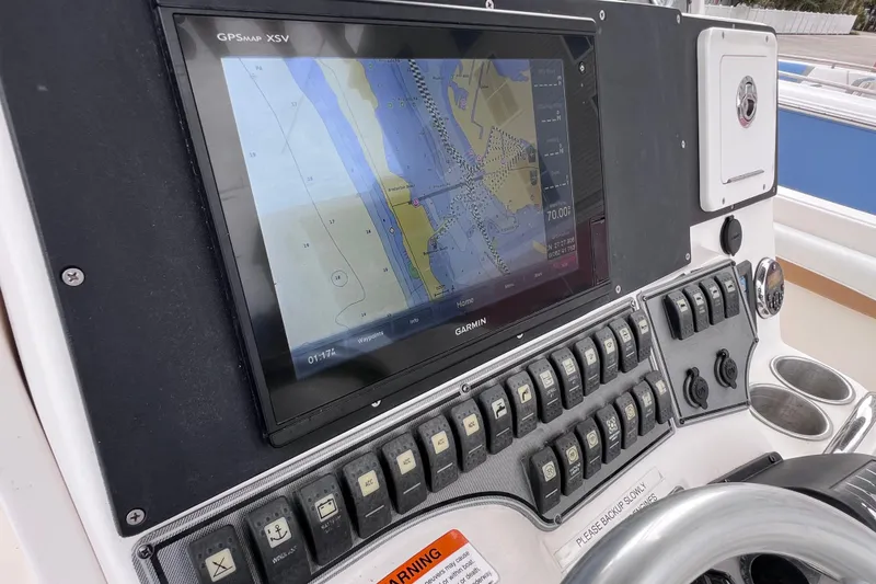 Slide: The Image of Control panel of a 2003 Wellcraft 29 CCF boat with Garmin GPSMAP XSV display. - 29
