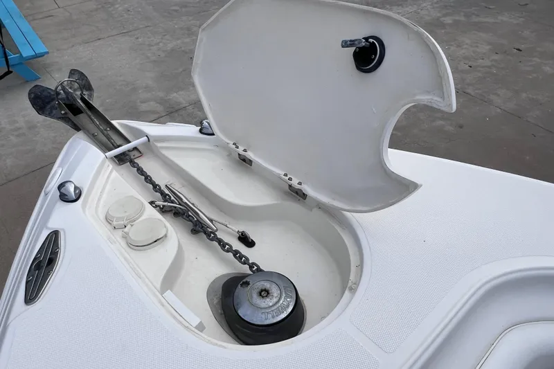 Slide: The Image of Anchor compartment of 2003 Wellcraft 29 CCF boat with open hatch and chain. - 38