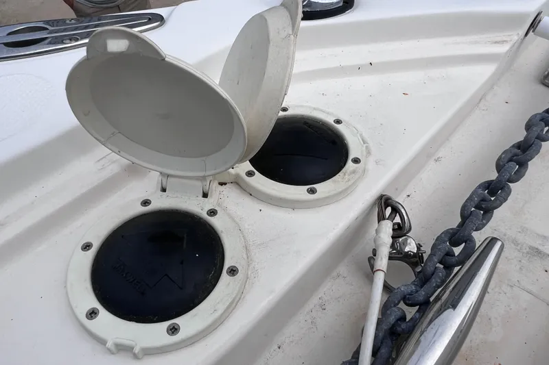 Slide: The Image of Open hatch covers on 2003 Wellcraft 29 CCF boat deck with anchor chain visible. - 39