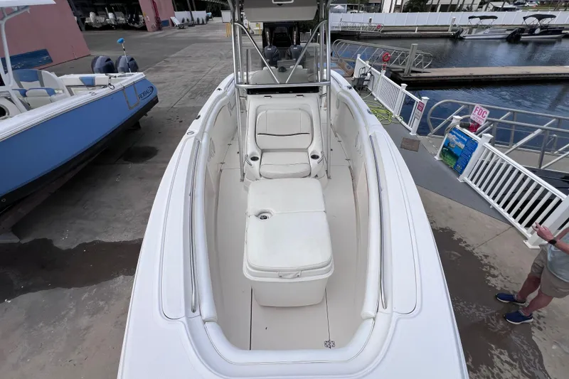 Slide: The Image of 2003 Wellcraft 29 CCF boat docked, showcasing spacious seating and sleek design. - 40