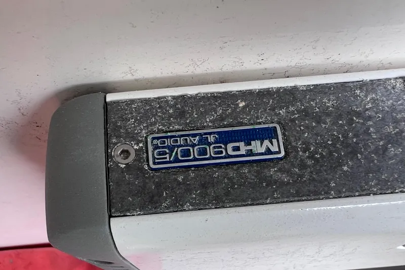 Slide: The Image of Close-up of a Wellcraft 29 CCF 2003 boat component with "MHD 900/6 JL Audio" label. - 53