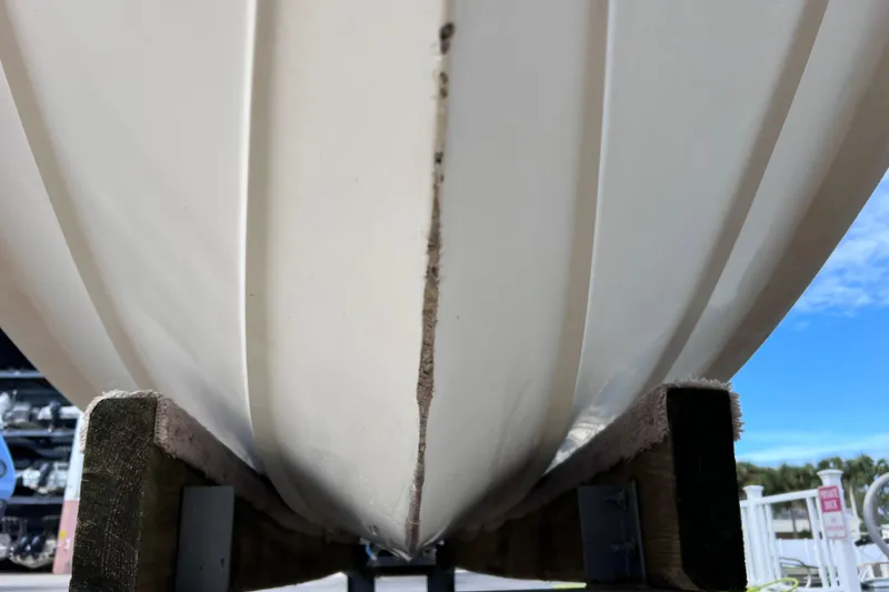 Slide: The Image of Close-up of 2003 Wellcraft 29 CCF boat hull on a wooden stand. - 62