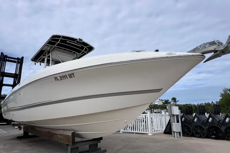 Slide: The Image of 2003 Wellcraft 29 CCF boat on display, showcasing sleek design and sturdy build. - 7