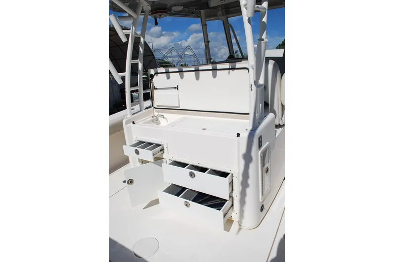 Slide: The Image of 2019 Cobia 344 Center Console boat interior with open storage drawers. - 10