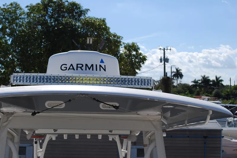 Slide: The Image of 2019 Cobia 344 Center Console with Garmin radar and LED light bar. - 19