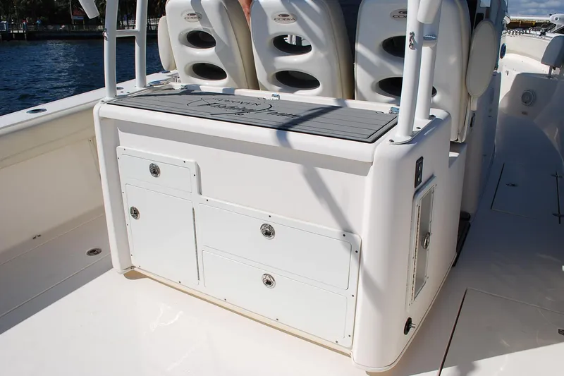 Slide: The Image of 2019 Cobia 344 Center Console boat interior with storage compartments and seating. - 9