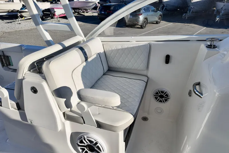 Slide: The Image of 2026 Sea Fox 288 Traveler boat interior with white cushioned seating and speaker system. - 12