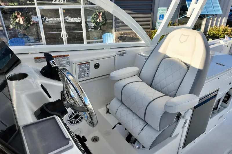 Slide: The Image of Luxurious helm seat of 2026 Sea Fox 288 Traveler boat with modern controls. - 13