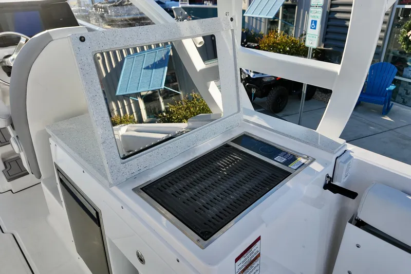 Slide: The Image of 2026 Sea Fox 288 Traveler boat interior with grill and countertop. - 17