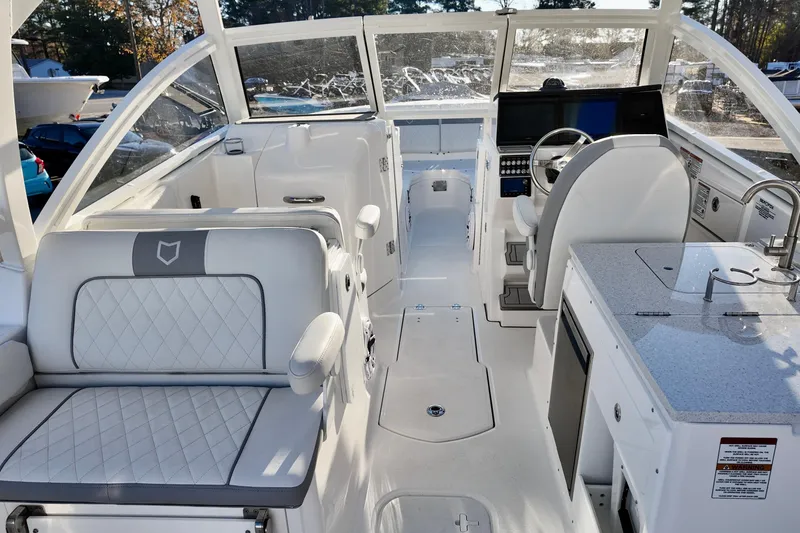 Slide: The Image of Interior of 2026 Sea Fox 288 Traveler boat with modern seating and helm. - 22
