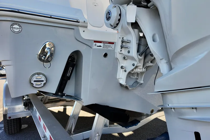 Slide: The Image of Rear view of 2026 Sea Fox 288 Traveler boat engine and trailer details. - 23