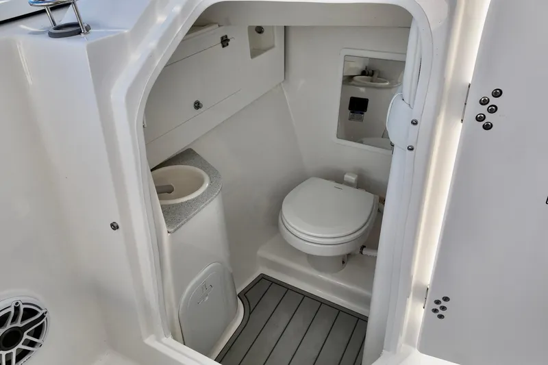 Slide: The Image of 2026 Sea Fox 288 Traveler boat bathroom with toilet and sink. - 5